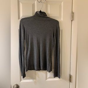 Woman’s gray long sleeve turtle neck